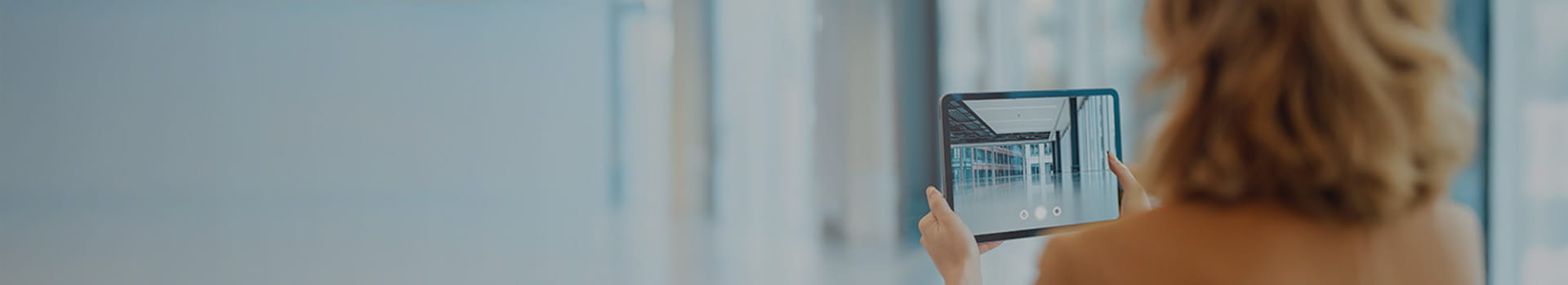 woman looking at a tablet