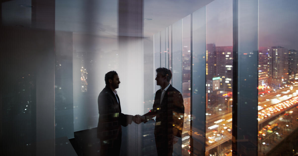 two men shaking hands