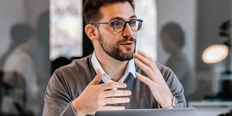 man gesturing and smiling