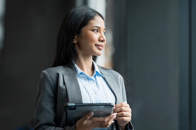 woman looking out a window