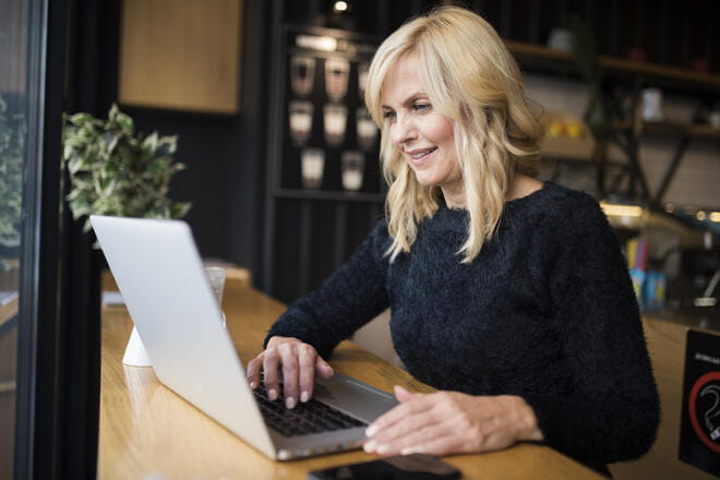 woman looking at her laptop