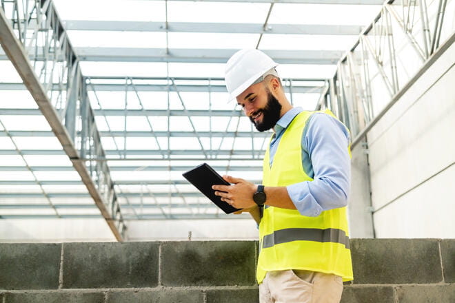 construction worker on a tablet