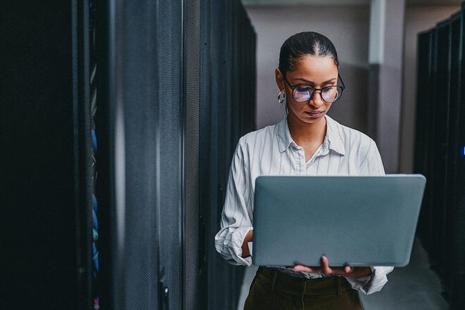 woman in glasses on a laptop