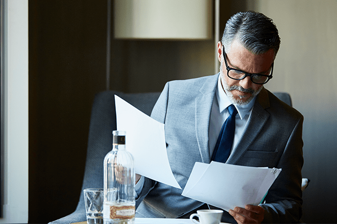 man looking at pages