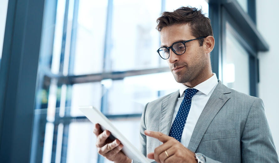 A professional businessman using a digital tablet.