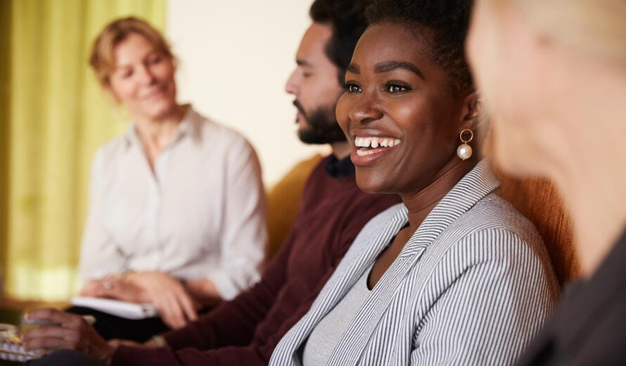A women smiling in the picture.
