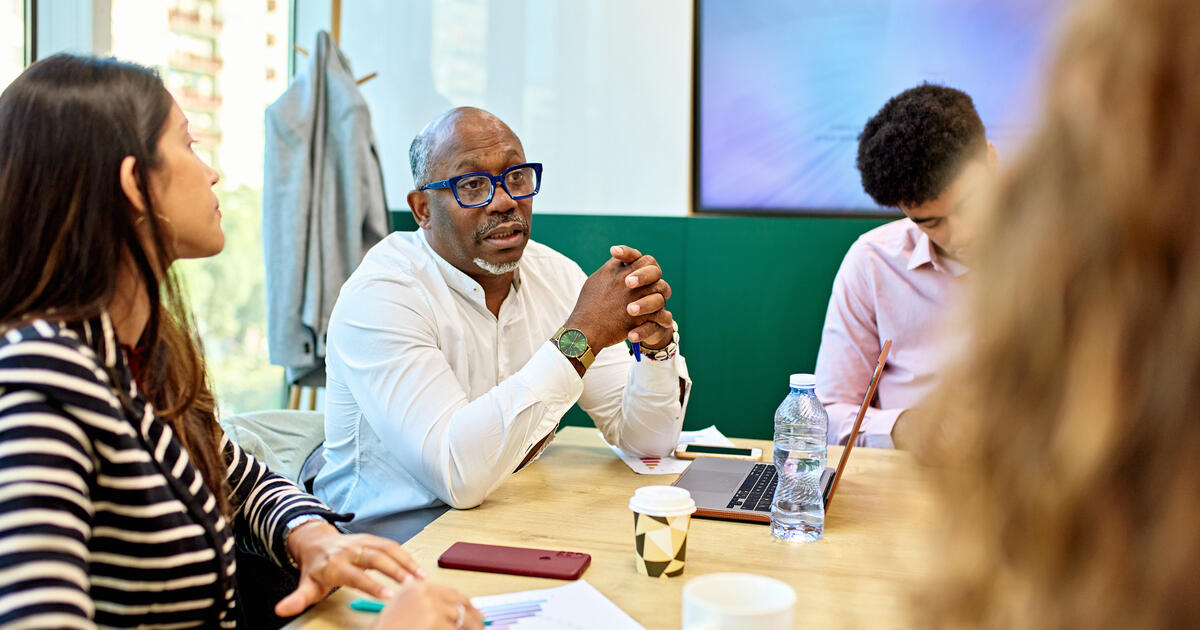 Professional team collaborating in a conference room meeting.