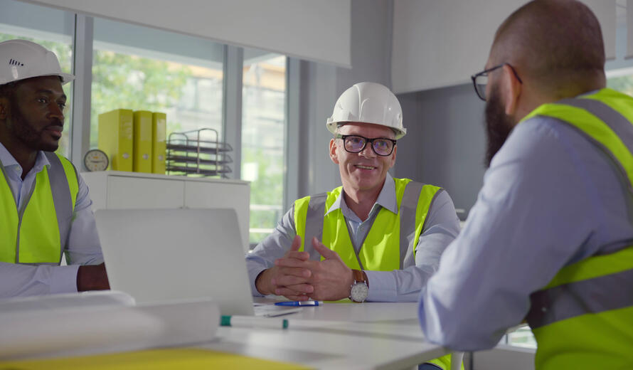 Professional photograph of individuals in safety vests.