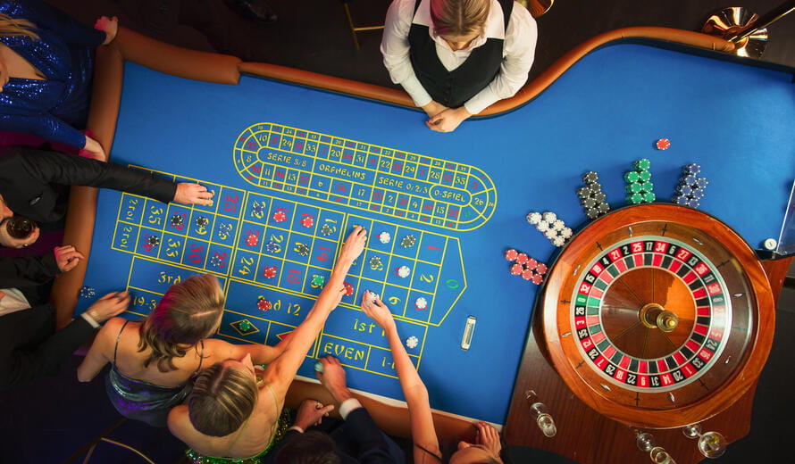 Guests Putting Betting Chips on a Gambling Table.