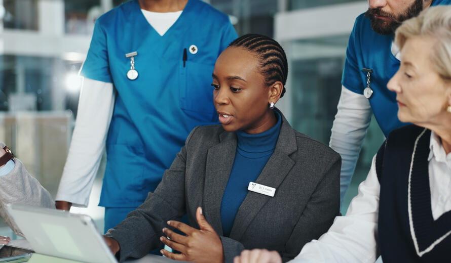 Healthcare professionals collaborating in a medical meeting.