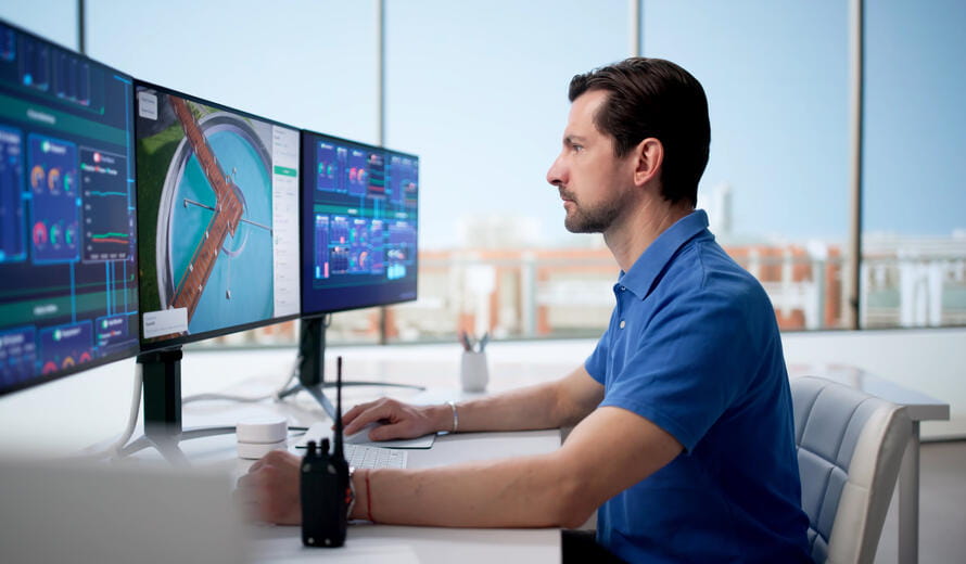 Man Inspecting Public Water System Using Computer Software For Quality Control.