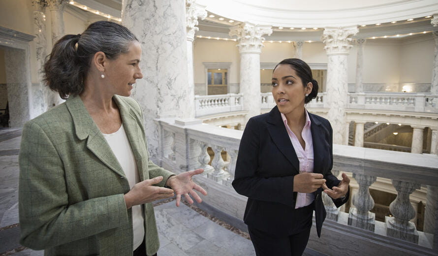 Politicians talking in government building