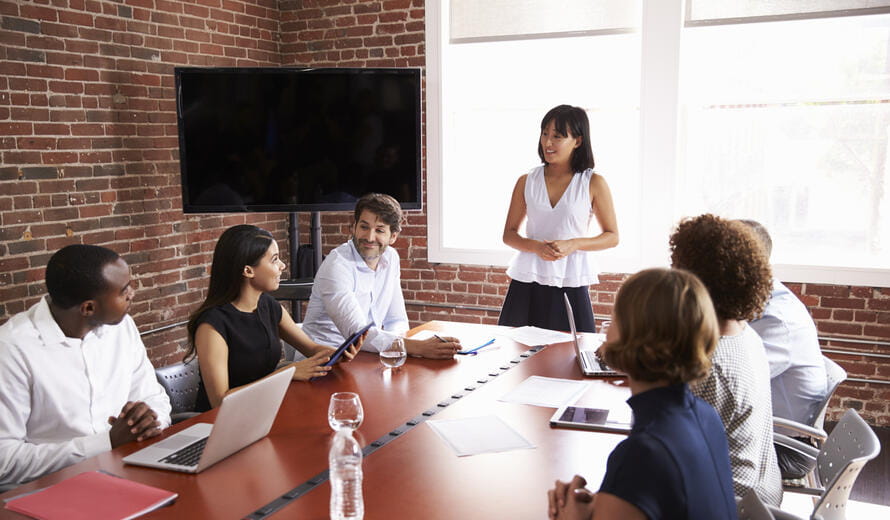 Businesswoman Addressing Boardroom Meeting