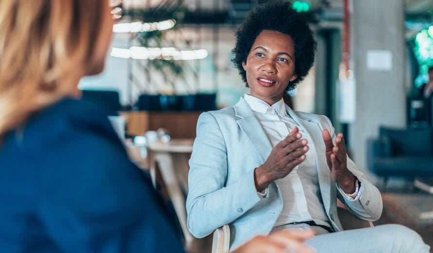 Middle aged businesswoman in a conversation with a colleague