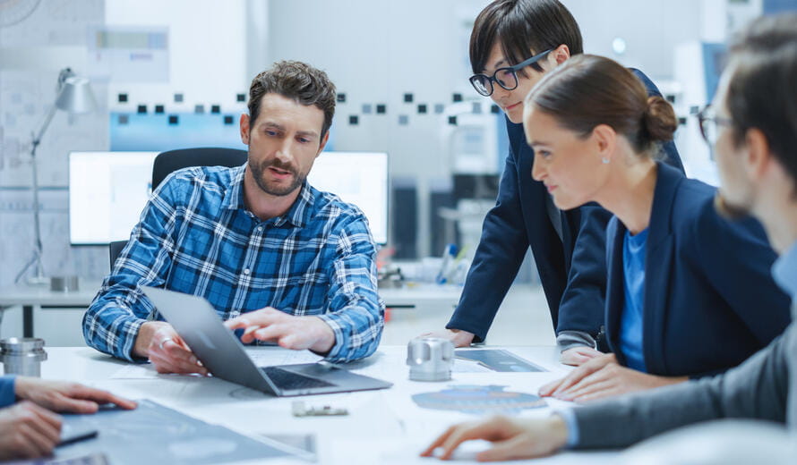 Multi-Ethnic and Diverse Team of Engineers, Managers, Investors Talking Sitting at Conference Table
