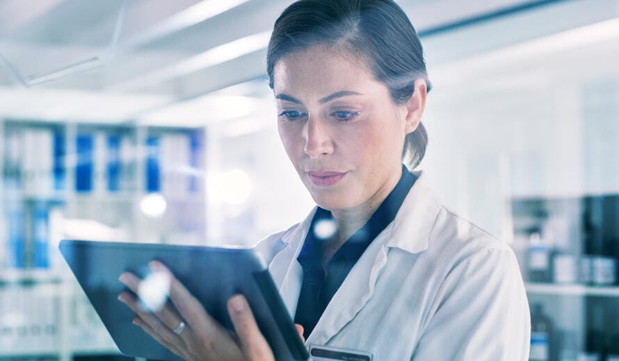 healthcare worker on a tablet