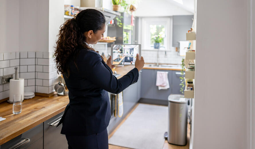 Real estate agent doing a virtual showing online using a tablet computer and live streaming