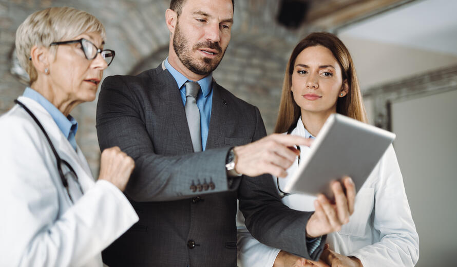 people looking at a tablet