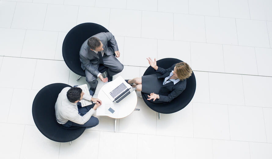 three business people having a meeting