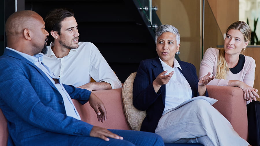 People smiling in a conference room