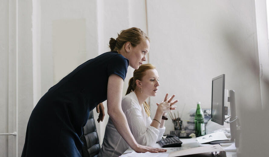 women looking at a computer