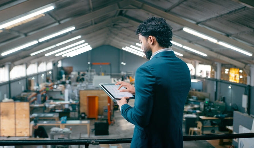 Engineering, businessman or tablet screen with chart in warehouse for MRP system, KPI data or info. Operations manager, person or tech for production schedule, manufacturing sales or inspection graph