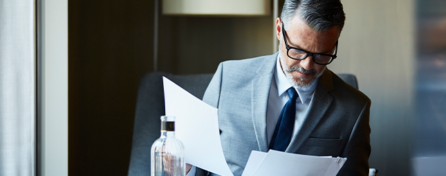 business man looking at papers
