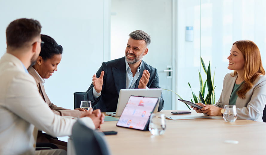 co-workers smiling in a meeting