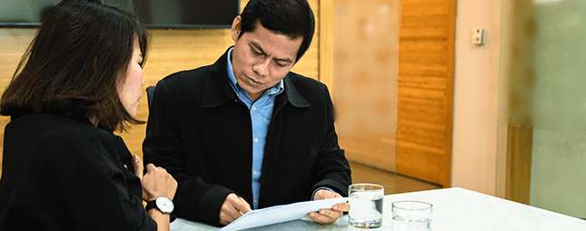 people reviewing a document