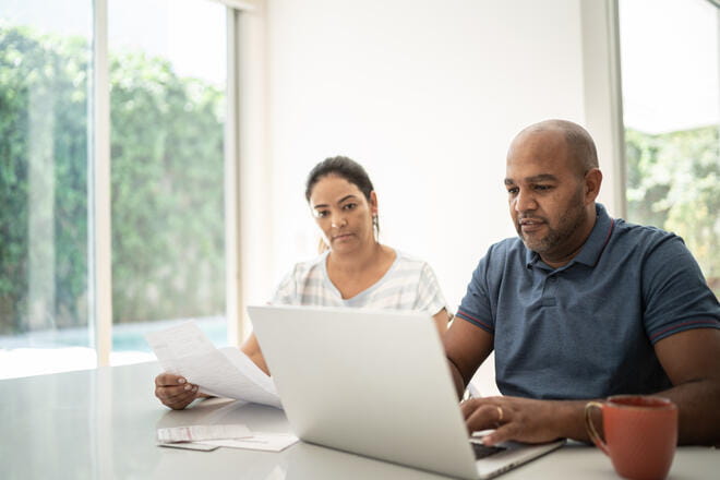 man and woman on a laptop